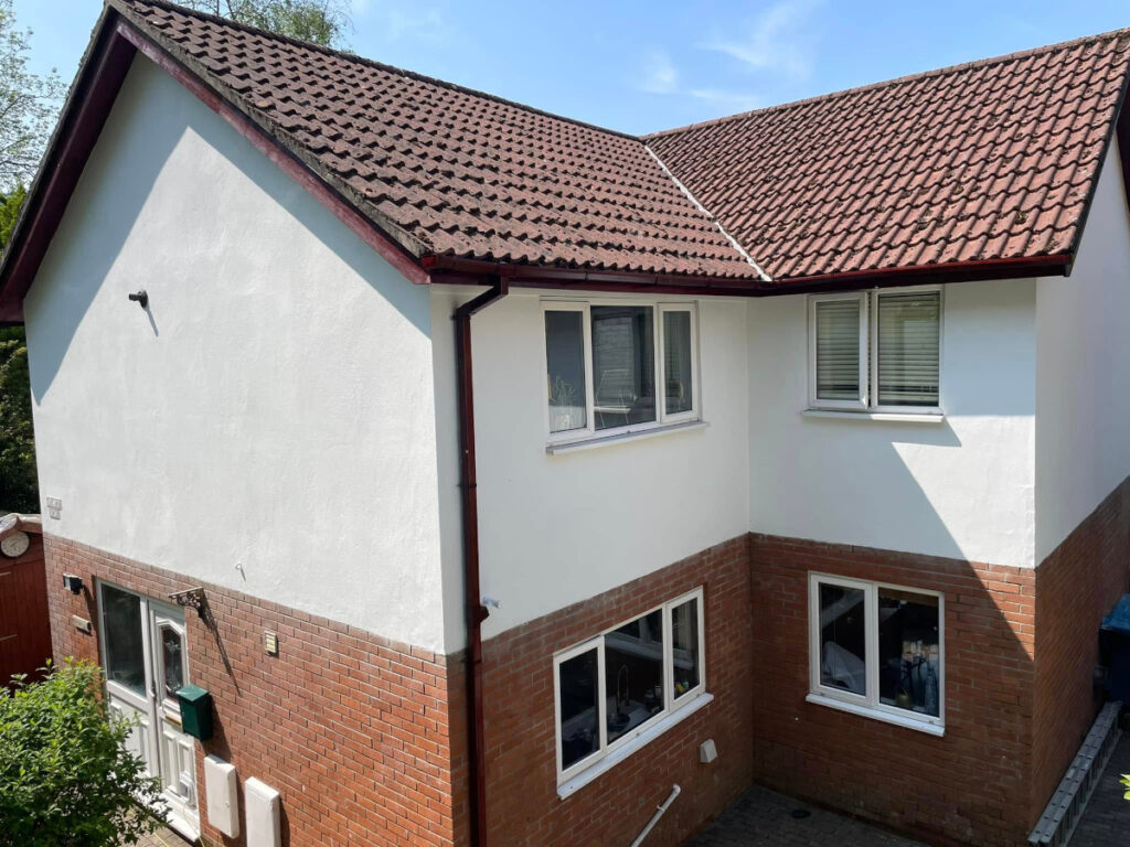 White painted render on a detached house in daylight