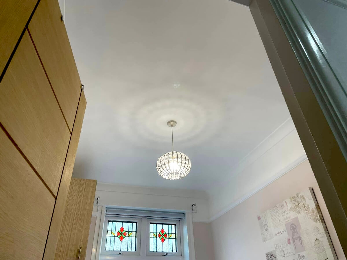 ceiling-painted-white-stained-glass-pendant-light-cardiff-primrose-decor Painted ceiling with pendant light and stained glass windows in Cardiff