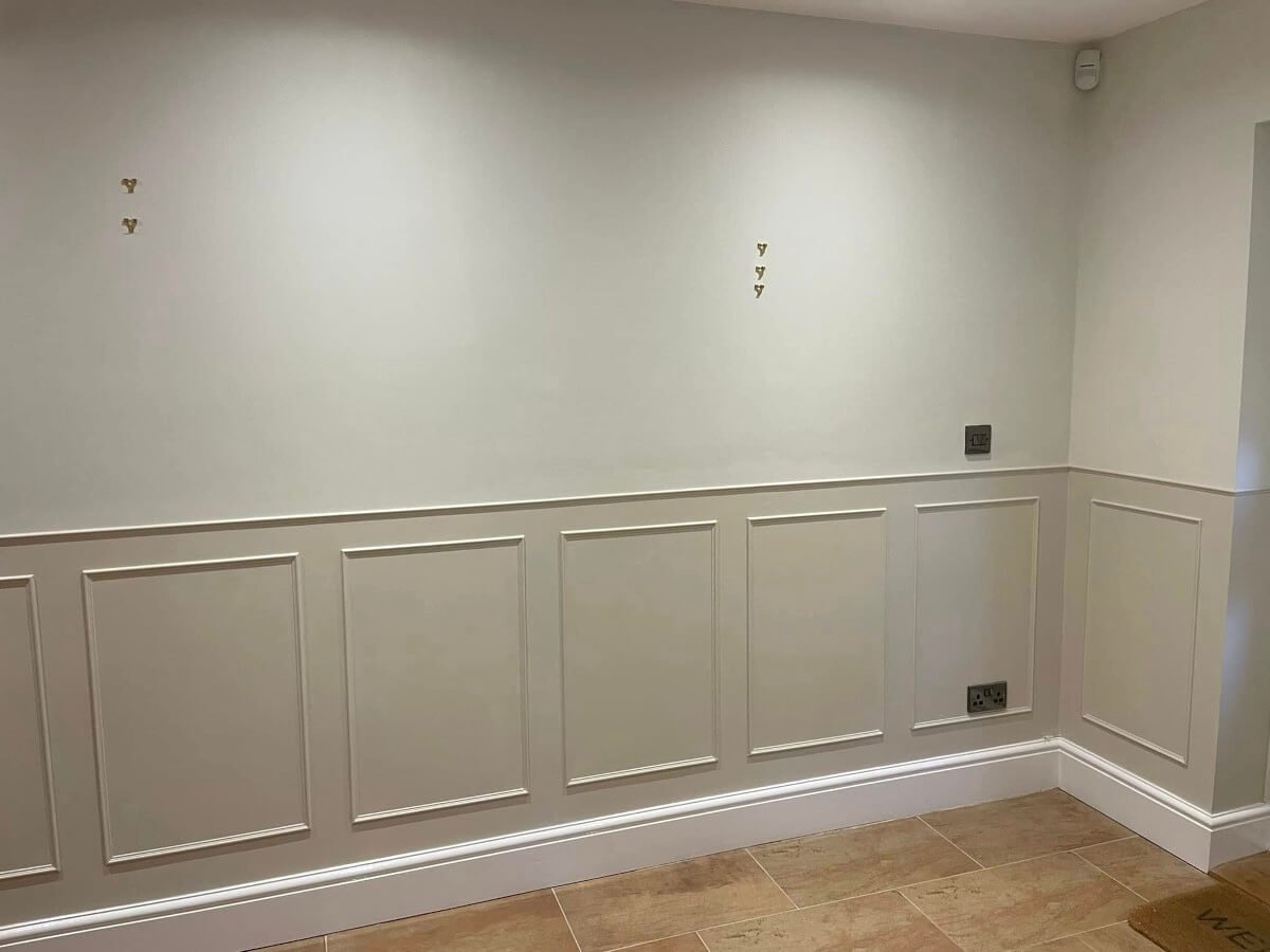 Cream and white painted wall panelling in hallway, Cardiff interior painting by Primrose Decor