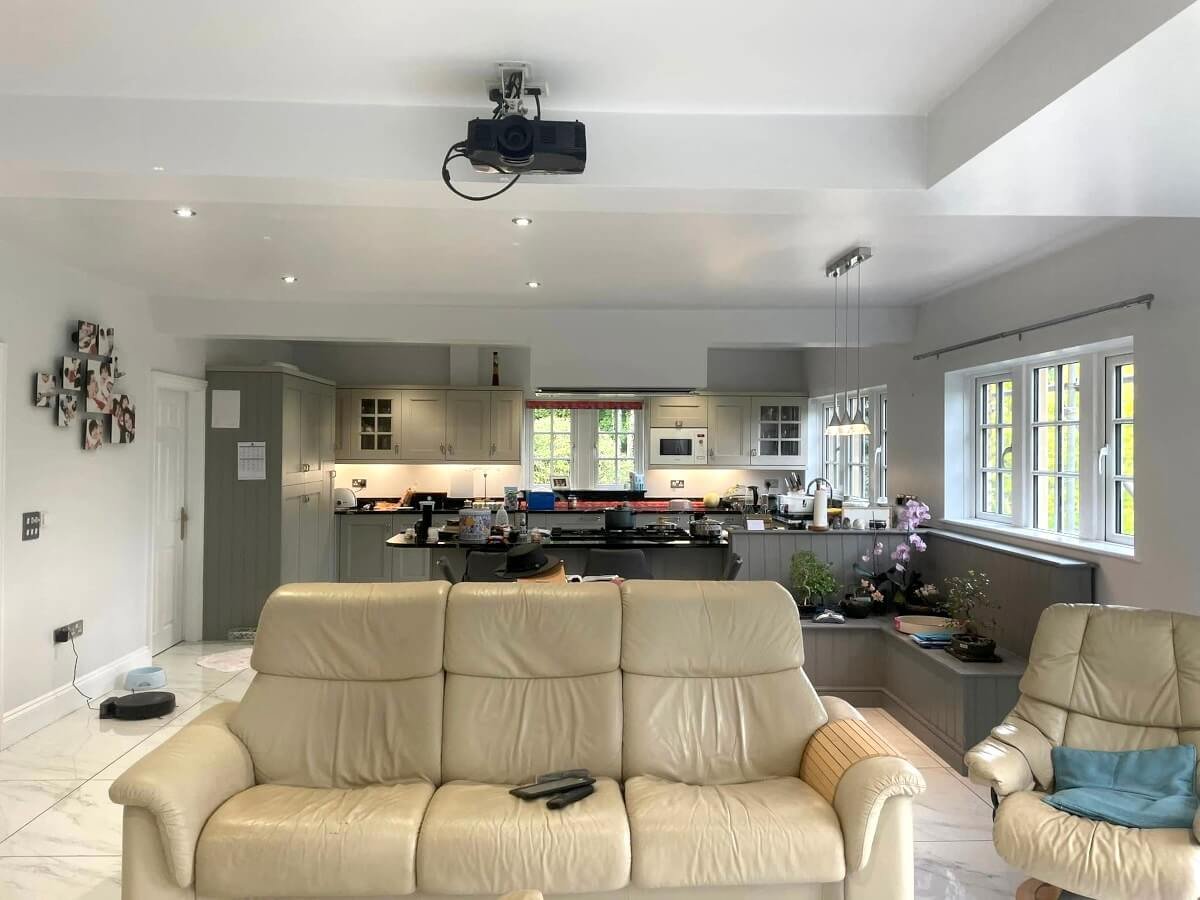 Open-plan kitchen diner with grey painted walls in Cardiff by Primrose Decor