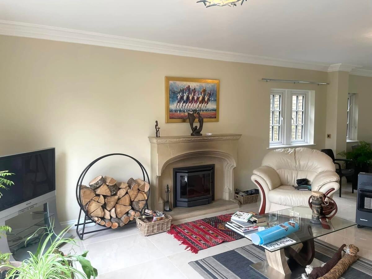 living-room-cream-painted-walls-stone-fireplace-cardiff-primrose-decor Living room with cream painted walls and stone fireplace in Cardiff, decorated by Primrose Decor