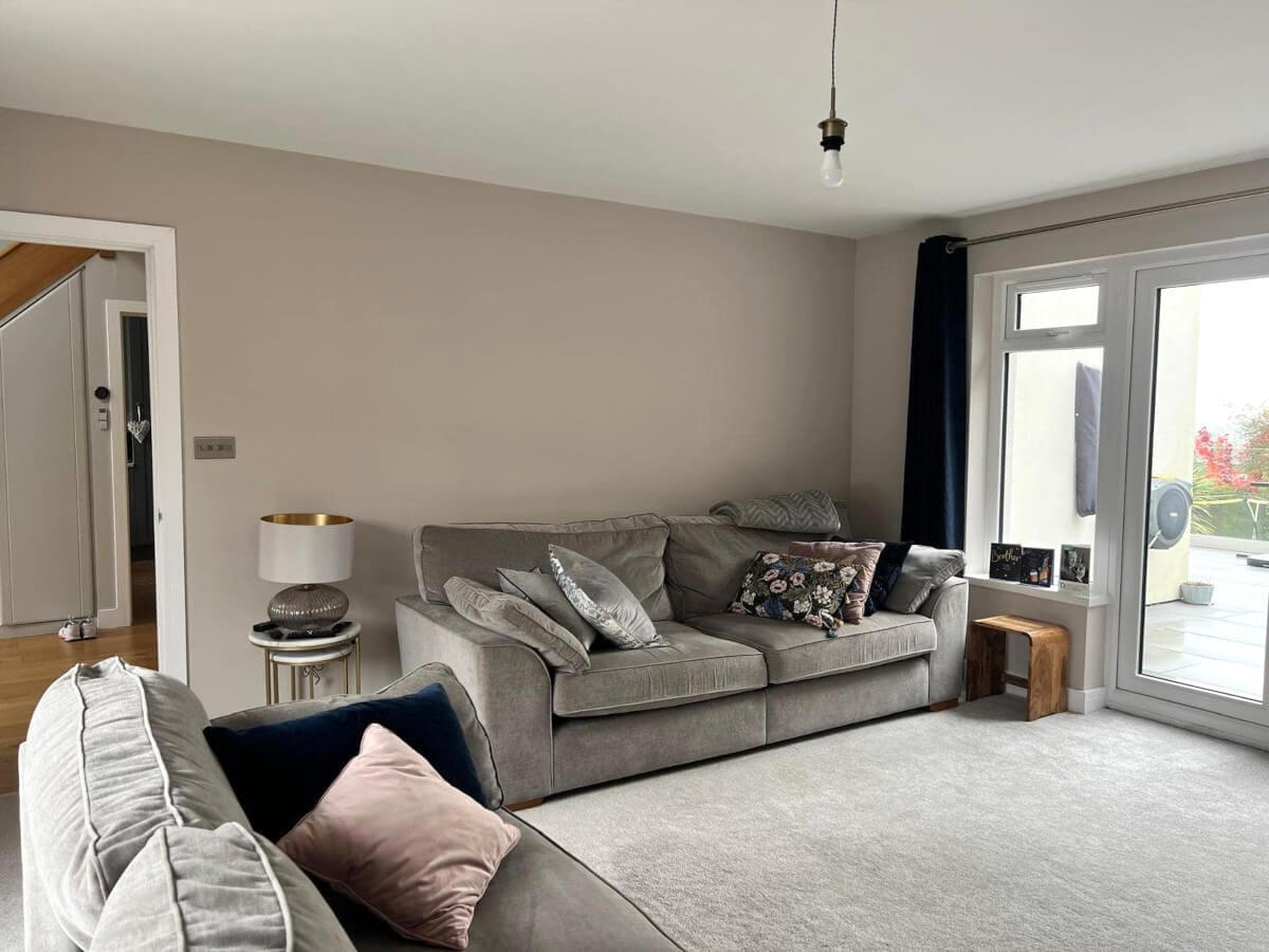 Interior living room painting in Rhiwbina Cardiff by Primrose Decor, grey painted walls with patio doors