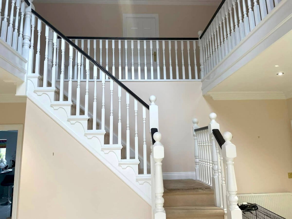 staircase-cream-painted-walls-white-banister-black-handrail-cardiff-primrose-decor Staircase with cream painted walls, white banister and black handrail in Cardiff by Primrose Decor